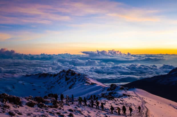 Indagare's Diana Li summits Kilimanjaro with her group at sunrise.