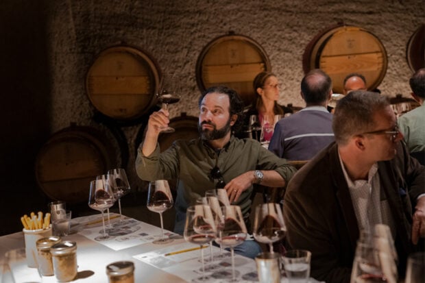 Howie tasting wine in the cellar at Bond in Napa Valley on the 2019 Insider Journey with WSJ. Photo by Matthew Baum.